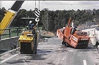 Melbourne cutting off the freeway parapet on the South East Fwy for the new bridge widening program